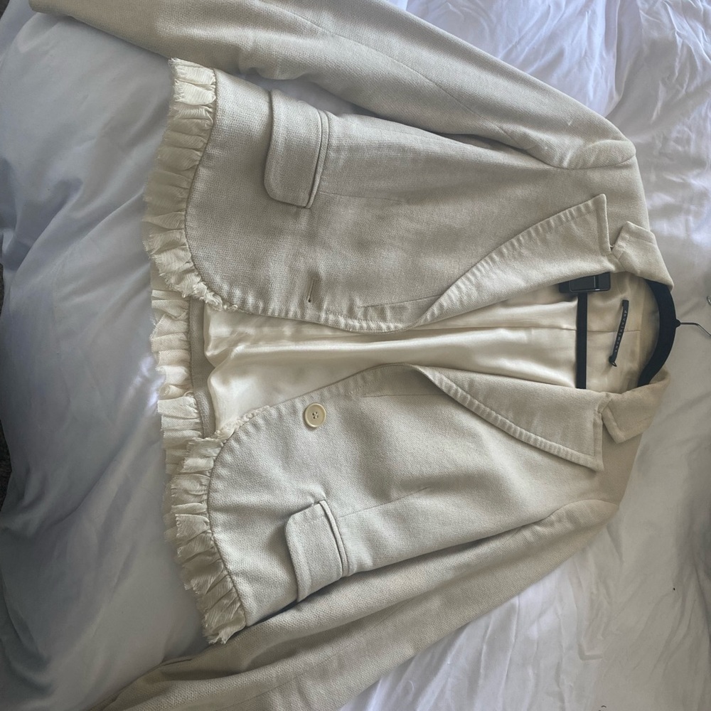 Development cream jacket in size 6.